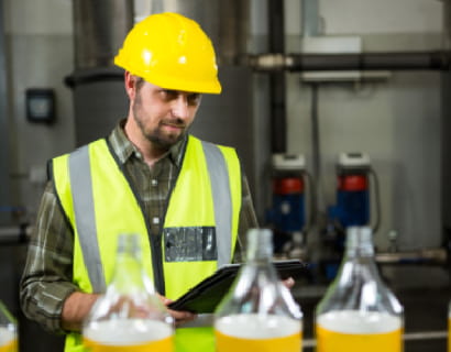 thoughtful-male-worker-with-digital-tablet-factory
